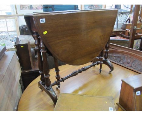 VICTORIAN MAHOGANY SUTHERLAND TABLE on bobbin turned supports and castor feet, 35"