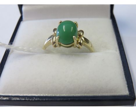 JADE RING, jade cabochon set in a 9ct yellow gold mount, size M/N