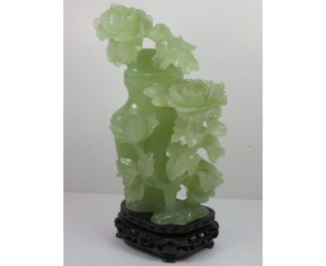 CHINESE JADE, a carved green jade floral design lidded vase on stand with presentation box 