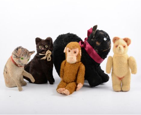 Vintage plush toy animals, including three cats, monkey and bear, along with a puppet on a stick with a bisque head circa 195