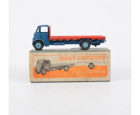 Dinky Toys; 512 Guy flat truck, blue cab, red bed and light blue hubs, in original box. 