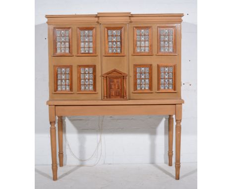 A Scale model of a Georgian gentleman's house; hand built with separate custom-built stand, hardwood floors, windows and door