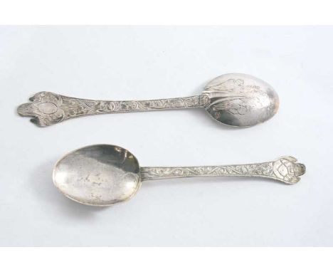 TWO LATE 17TH CENTURY ENGRAVED TREFID SWEETMEAT SPOONS traces of gilding, one initialled "KD" &amp; engraved with a portrait 