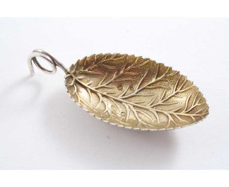 A GEORGE III CADDY SPOON with a coiled wire handle & a gilt veined leaf bowl, by Joseph Wilmore, Birmingham 1805; 2.55"  (6.5