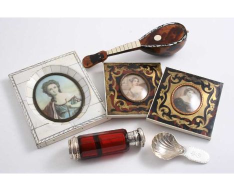 A MIXED LOT: A pair of portrait miniatures with brass-inlaid tortoiseshell frames, another miniature with an ivory-clad frame