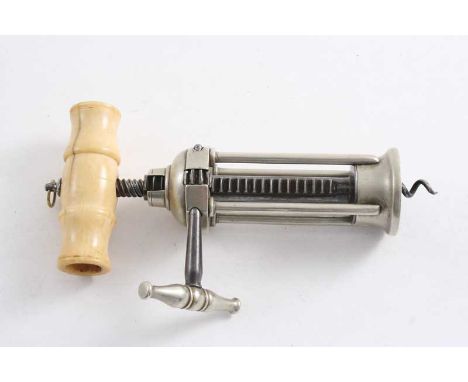 A NICKEL & STEEL "RACK" CORKSCREW with four pillars & a turned ivory handle;  7.25"  (18.2 cms) long