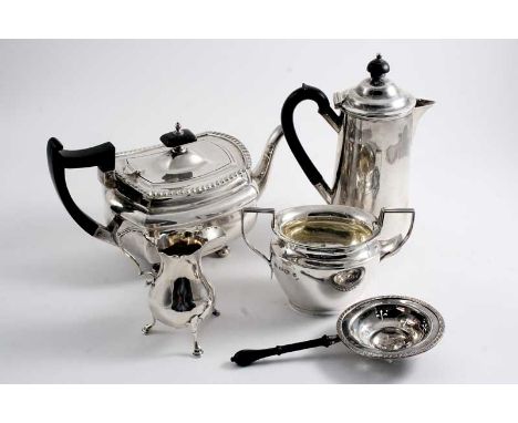 A MIXED LOT: A tea pot of rounded oblong form by Walker & Hall, Sheffield 1927, a hot water jug, a tea strainer, a sugar basi