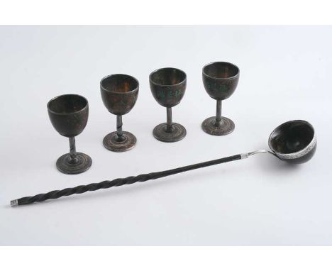 A SET OF FOUR 19TH CENTURY CHINESE MOUNTED COCONUT LIQUEUR GOBLETS with engraved character marks on the side & a character ma