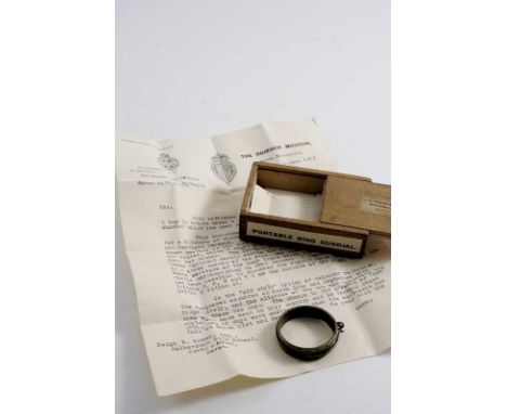 A BRASS ANNULAR POCKET SUNDIAL probably 18th century, contained in a box with some related literature;  1.5"  (4 cms) diamete