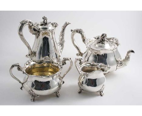 BY PAUL STORR: A George IV four piece tea & coffee service with circular baluster bodies, shaped foliate rims & leafy scroll 