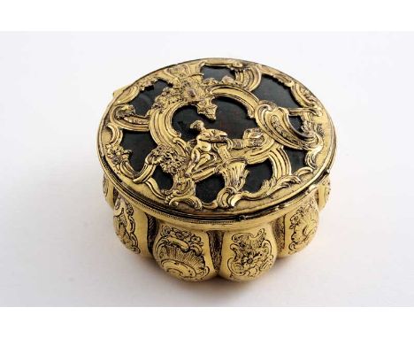 A GEORGE II / III GILT COPPER SNUFF BOX with a lobed circular body decorated with chasing, the cover cagework-mounted with bl