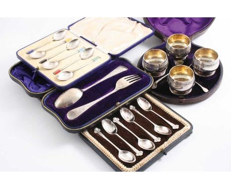 A CASED SET OF FOUR VICTORIAN SALTS & FOUR SPOONS by Charles Edwards, London 1877, a cased set of six coffee spoons with plum