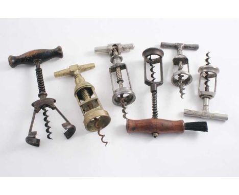 A BRASS BODIED "LA VESPA" CORKSCREW steel worm, a wooden handled steel corkscrew with spring, a nickel-plated steel corkscrew