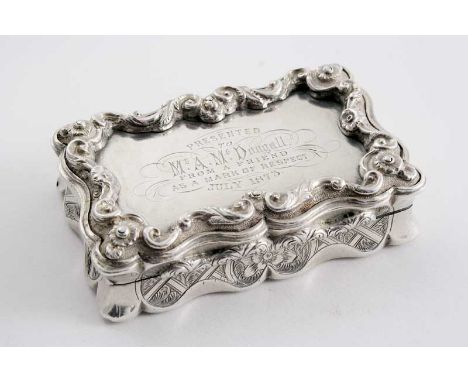 A VICTORIAN SNUFF BOX of shaped rectangular outline with an engraved base & sides & raised border around the cover, inscribed