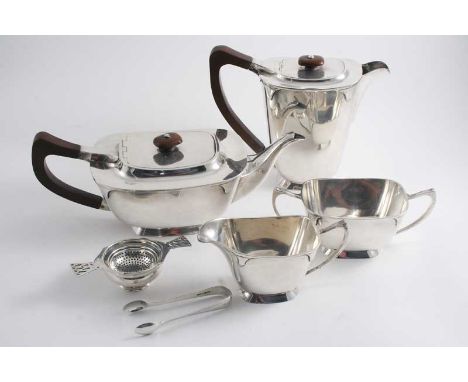 AN ART DECO FOUR PIECE TEA SERVICE of rounded oblong form with upswept handles, by C.S. Green & Co., Birmingham 1936 together