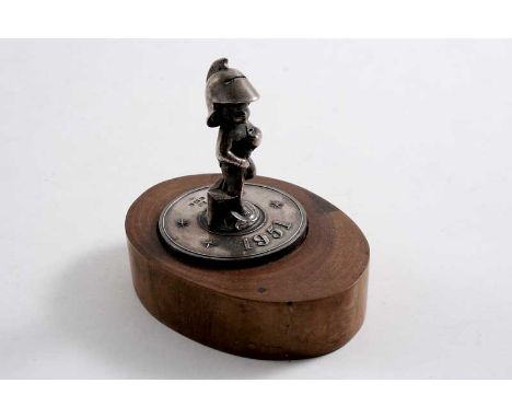 BY LESLIE G. DURBIN: A post war, cast miniature figure, commemorating the 1951 Festival of Britain Exhibition*, hallmarked Lo