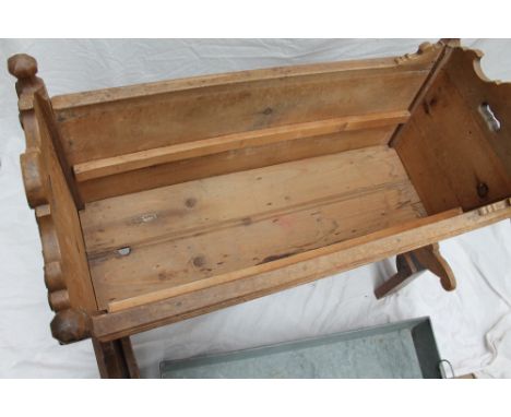 A Swiss pine cradle, with penwork decorated panels, on a later stand and inset zinc planter, 88cm long x 42cm wide