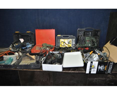 A COLLECTION OF POWER TOOLS including a Titan router, a Performance Pro biscuit jointer, a Champion cordless drill with one b