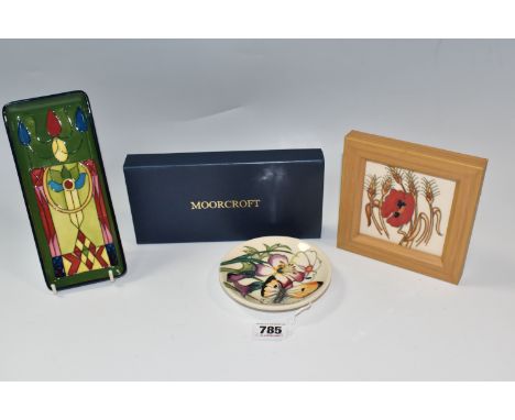 THREE PIECES OF MOORCROFT POTTERY comprising a boxed rectangular pen dish with an art nouveau pattern length 20cm x width 8.5