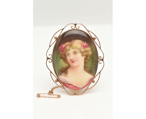 A 9CT GOLD PAINTED ROYAL DOULTON PORTRAIT BROOCH, of an oval form displaying a painted portrait of 'Leslie Johnson', signed '