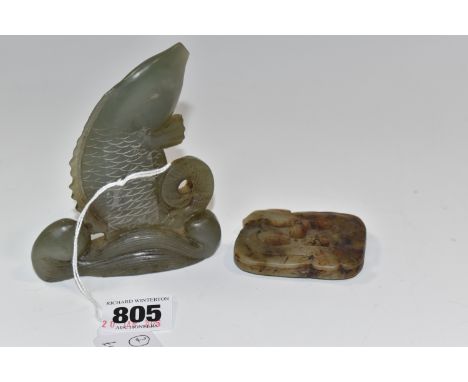 TWO GREEN HARD-STONE ITEMS comprising a carved fish emerging from waves with etched detail to the scales, height approximatel