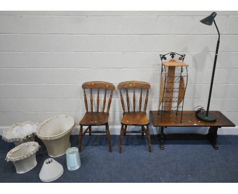 AN OAK RECTANGULAR COFFEE TABLE, with trestle style legs, 107cm x depth 44cm x height 42cm, a standard lamp, a magazine rack,