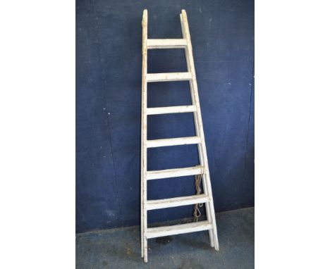 A VINTAGE WOODEN SET OF STEP LADDERS with 7 rungs to each 190cm section