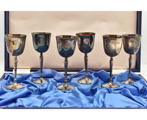A CASED SET OF SIX ELIZABETH II SILVER GOBLETS, six matching goblets with long bluster stems and gilt interior, approximate h