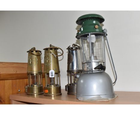 THREE MINERS' LAMPS AND A VAPALUX LANTERN, comprising three Eccles Protector Lamp &amp; Lighting Co Type 6 miners' lamps, tog