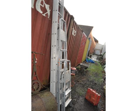 AN ALUMINIUM DOUBLE EXTENSION LADDER with 15 rungs to each 380cm length (one rung bent) and two step ladders (3)