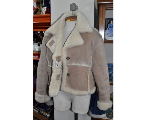 MARY QUANT: A VINTAGE SHEEPSKIN JACKET, a 1970's iconic beige sheepskin jacket, ladies UK size 12, together with a ladies blu