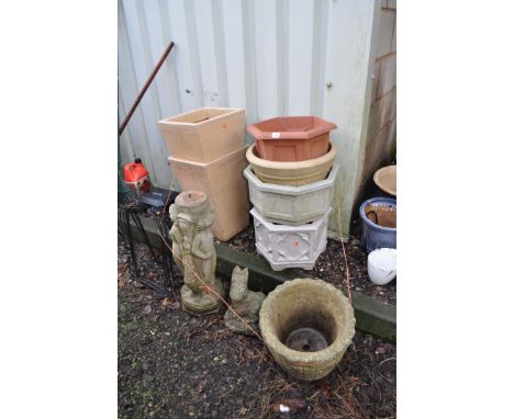 A COLLECTION OF MODERN AND PLASTIC GARDEN ORNAMENTS AND PLANTERS including a birdbath base, a barrel effect planter and a fig