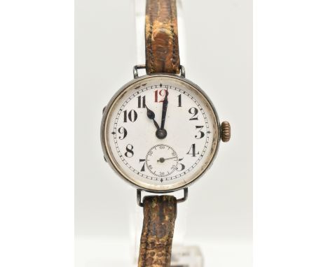 A GENTS SILVER EARLY 20TH CENTURY TRENCH STYLE WATCH, manual wind, round white dial with Arabic numerals, subsidiary dial at 