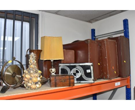 A GROUP OF VINTAGE SUITCASES AND DECORATIVE ITEMS to include four brown leather suitcases of various sizes, a shell-encrusted
