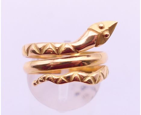 An Eastern gold snake form ring.  Ring size Q/R, 6.1 grammes.