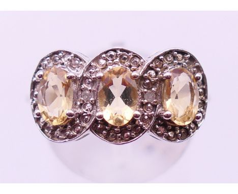 A silver Amarelo Beryl and diamond ring, with certificate. Ring size P. 