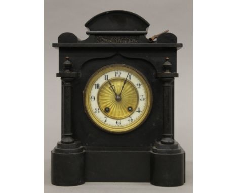 A Victorian black slate mantle clock. 29.5 cm high.