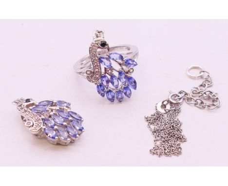A tanzanite set pendant on chain and a ring. ring size N.