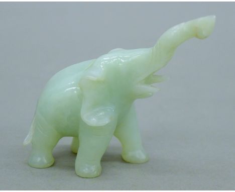 A small jade elephant. 7 cm high.
