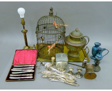 A quantity of various metalwares including a Tibetan teapot and a bird cage. The latter 46 cm high.