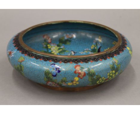 A late 19th century Chinese cloisonne light blue ground circular bowl of squat form. 25.5 cm diameter.