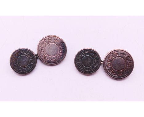 A pair of Hermes silver cufflinks. 1.2 cm diameter.