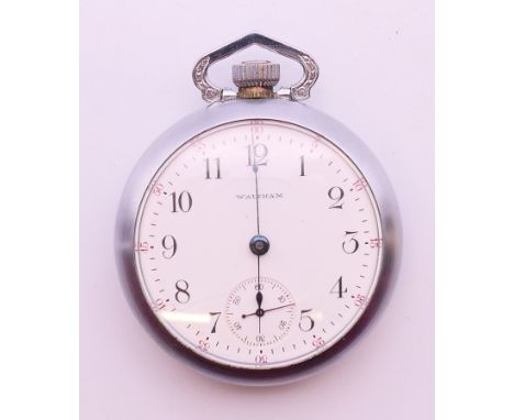 A Waltham pocket watch. 5 cm diameter.