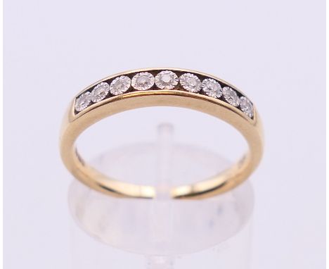 A 9 ct gold nine stone diamond ring. Ring size N.