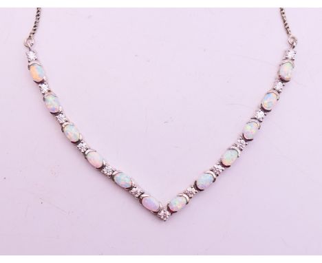 An opal and diamond necklace, 52 cm long.