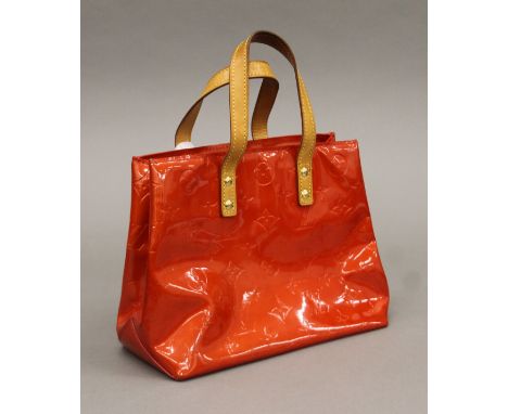 A Louis Vuitton red Vernis Reade handbag. 23 cm x 10.5 cm x 18 cm.