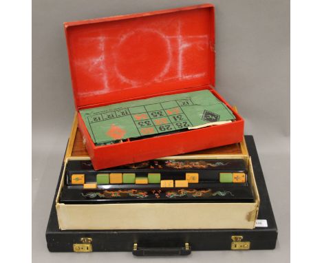 Four vintage table-top games: roulette, backgammon, mahjong and drafts/backgammon. The largest 51 cm wide.