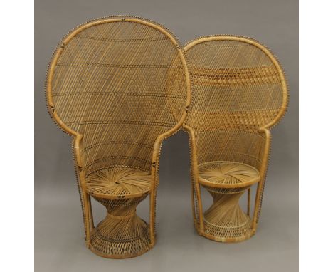 Two cane throne chairs. The largest 93 cm wide x 149 cm high.