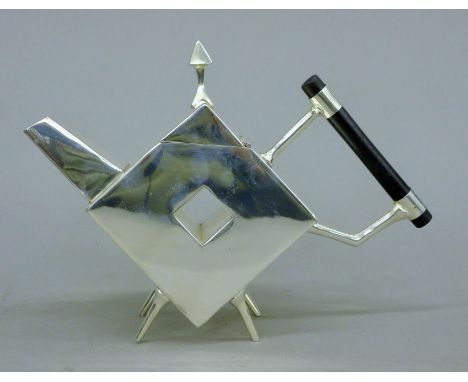 A silver-plated Christopher Dresser-style teapot. 17.5 cm high.