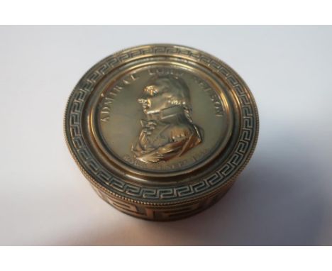 Admiral Lord Nelson commemorative circular brass tobacco box with bust to the top with Birthday 29th Sep 1758, Greek key bord